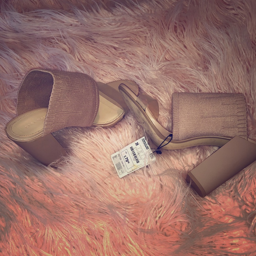 Blush pink mule shoes.